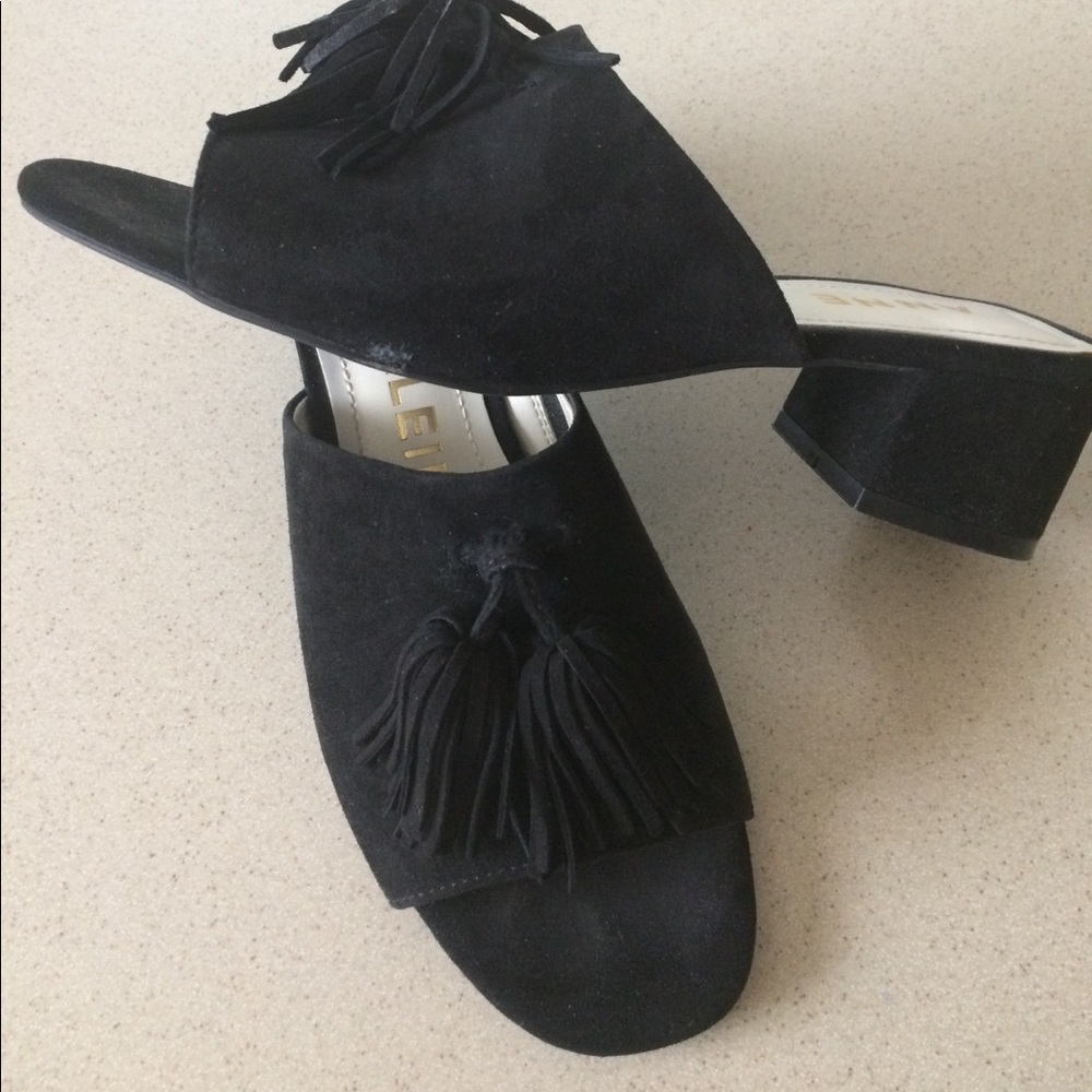 Anne Klein black suede slides with tassels.